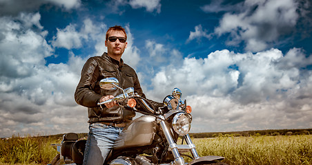 Image showing Biker on a motorcycle