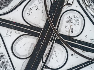 Image showing Aerial view of a freeway intersection Snow-covered in winter.