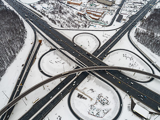 Image showing Aerial view of a freeway intersection Snow-covered in winter.