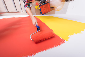 Image showing couple painting interior wall