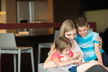 Image showing Young Family Using A Tablet To Make Future Plans