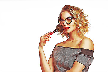 Image showing Portrait of female stylist standing with makeup brushes