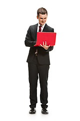 Image showing Full body portrait of businessman with laptop on white