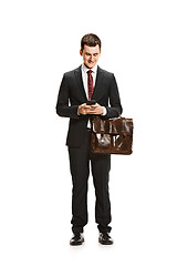 Image showing Full body portrait of businessman with briefcase on white