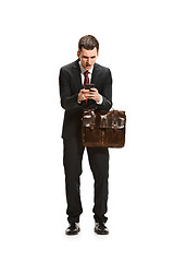 Image showing Full body portrait of businessman with briefcase on white