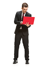 Image showing Full body portrait of businessman with laptop on white