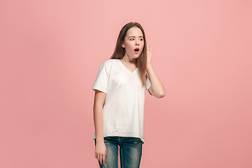 Image showing The happy teel girl standing and listening