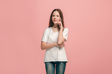 Image showing Young serious thoughtful teen girl. Doubt concept.