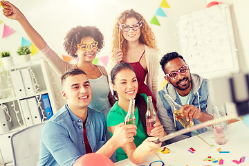 Image showing happy team taking selfie at office party