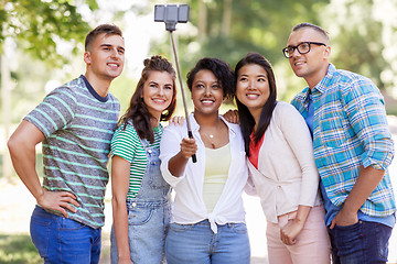 Image showing international friends taking selfie in park