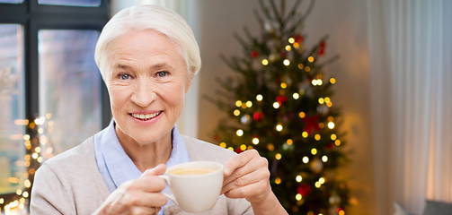 Image showing happy senior woman with cup of coffee