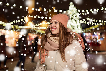 Image showing happy young woman at christmas market in winter