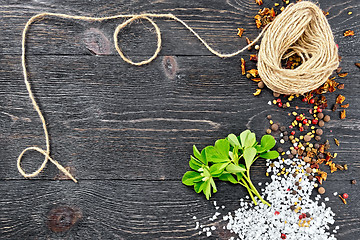 Image showing Fenugreek leaves with twine on black board