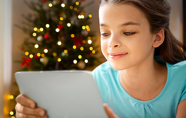 Image showing close up of girl with tablet pc on christmas