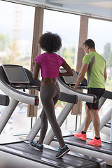 Image showing people exercisinng a cardio on treadmill