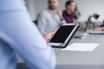 Image showing Businessman using tablet in modern office