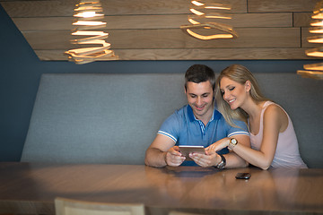 Image showing couple using tablet at home