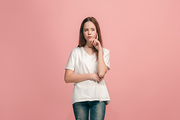 Image showing Young serious thoughtful teen girl. Doubt concept.