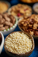 Image showing Assortment of different kinds cereals placed in ceramic bowls on table