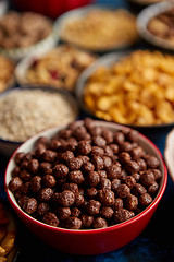 Image showing Assortment of different kinds cereals placed in ceramic bowls on table