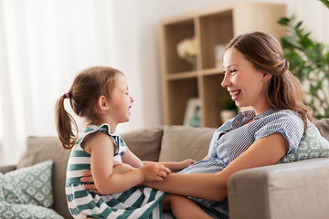 Image showing pregnant mother and daughter at home