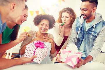 Image showing team greeting colleague at office birthday party