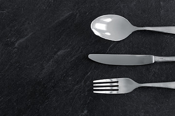 Image showing close up of fork, knife and spoon on table