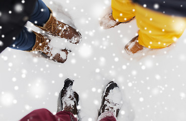 Image showing group of people feet on snow