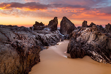 Image showing Ocean sunrise with craggy rock channels near Narooma
