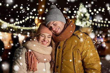 Image showing happy couple hugging at christmas tree