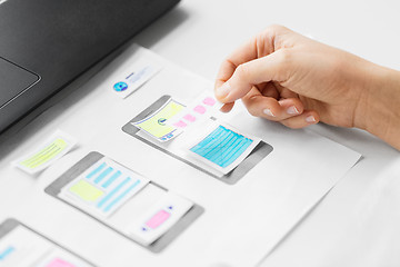 Image showing web designer working on user interface wireframe