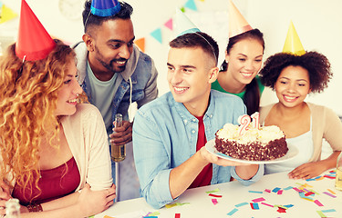 Image showing team greeting colleague at office birthday party