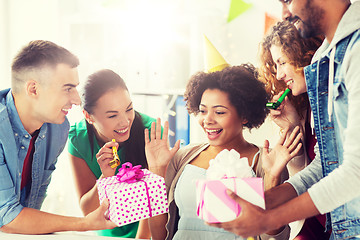 Image showing team greeting colleague at office birthday party