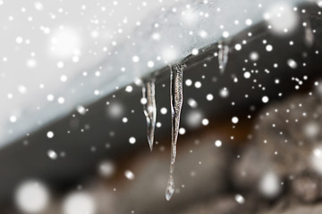 Image showing icicles and snow hanging from building roof