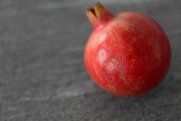 Image showing close up of pomegranate on stone table