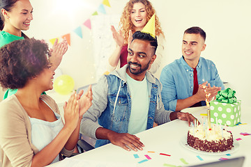 Image showing office team greeting colleague at birthday party