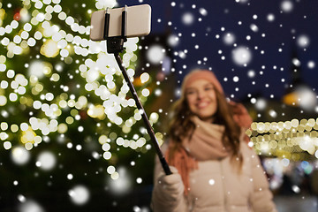 Image showing young woman taking selfie at christmas town