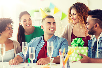 Image showing team greeting colleague at office birthday party