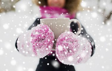 Image showing close up of woman with tea mug outdoors in winter