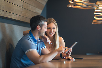 Image showing couple using tablet at home