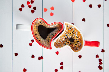 Image showing Two heart shaped coffee cups conected with each other.