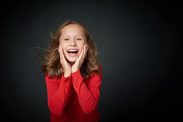 Image showing Excited surprised preteen girl screaming of joy