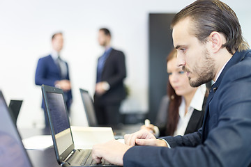 Image showing Business people in modern corporate office.