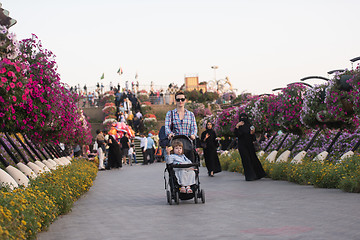 Image showing mother and daughter in flower garden