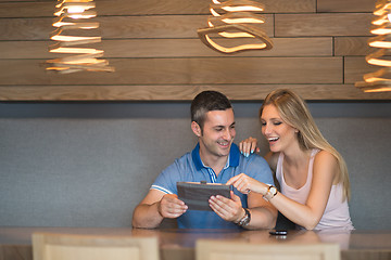 Image showing couple using tablet at home