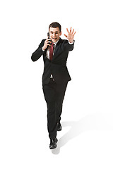 Image showing Funny cheerful businessman over white background