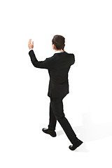 Image showing The back of businessman over white background