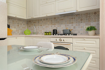 Image showing Modern beige colored kitchen and dining room