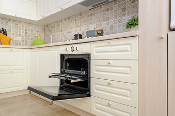 Image showing Modern beige colored kitchen and dining room