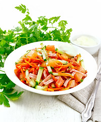 Image showing Salad of sausage and spicy carrots on table